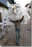 man carrying recycled bags